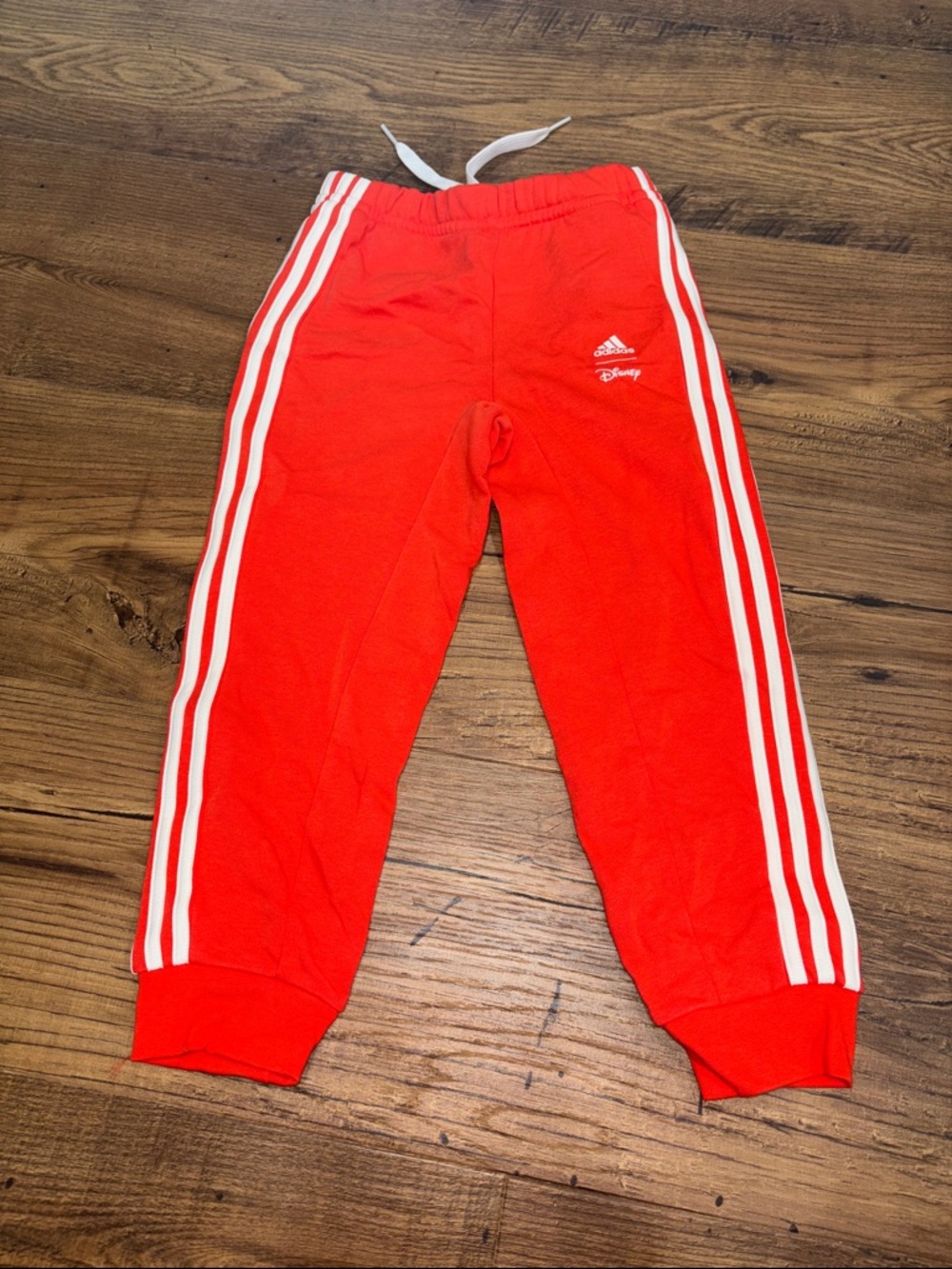 adidas Disney kids Orange Kids Joggers with White Stripes and Disney logo